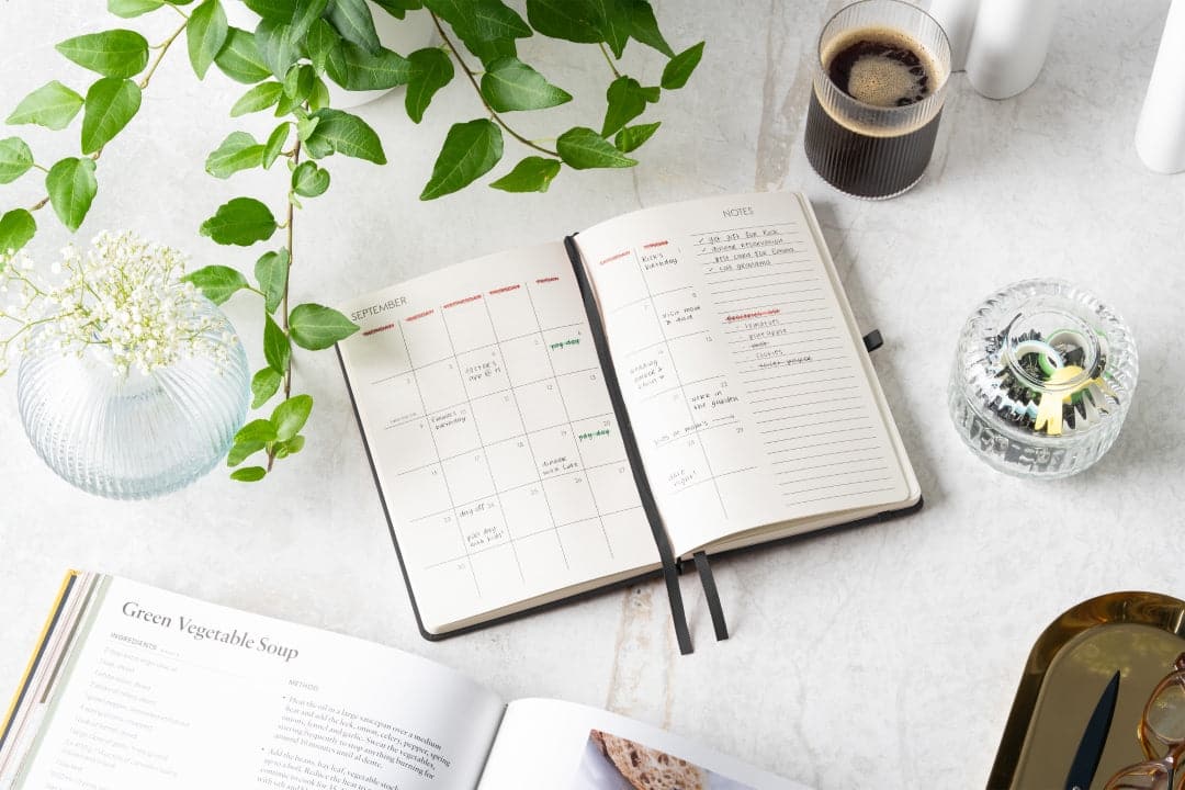 A5 weekly organizer in deep Charcoal Black, designed for professionals and minimalists